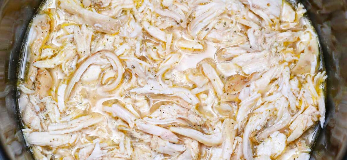 photo of shredded chicken breasts in the slow cooker