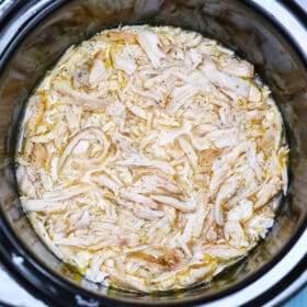 photo of shredded chicken breasts in the slow cooker