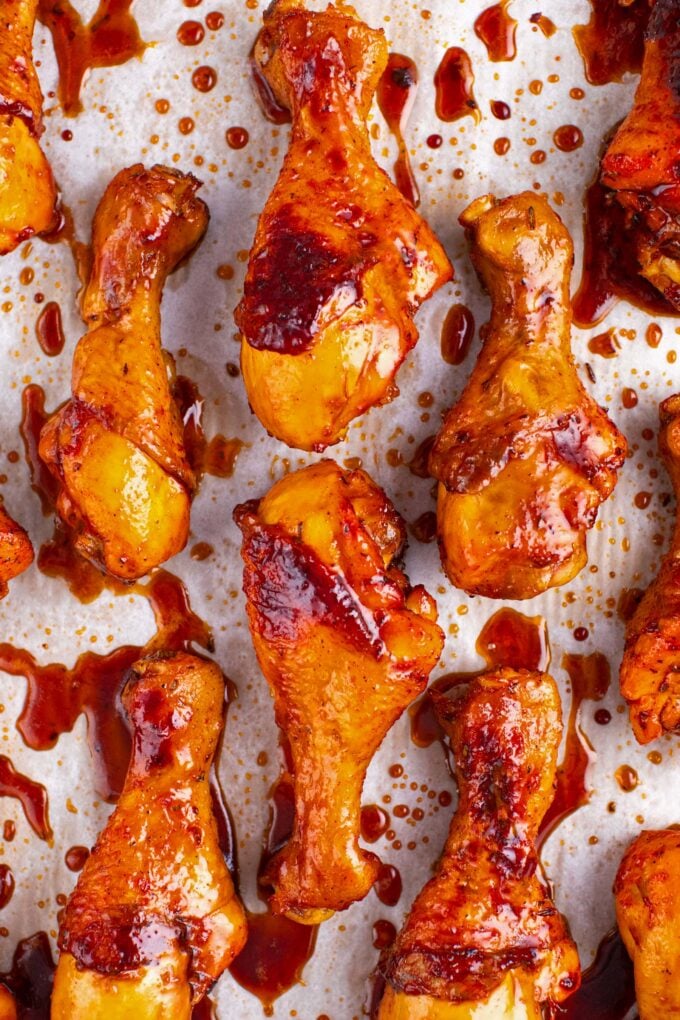 Overhead shot of crispy baked chicken legs on a baking sheet.