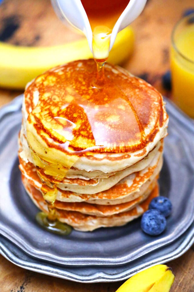 photo of stack of greek yogurt pancakes and maple syrup