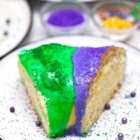 image of king cake slice with purple and green glaze