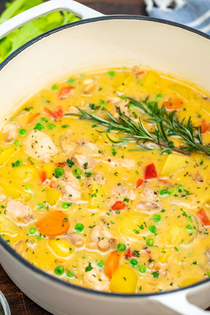 Chicken stew with potatoes, carrots, and peas.