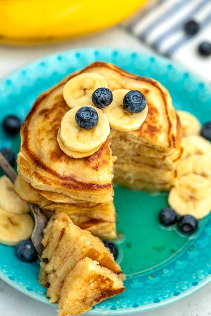 image of pancakes topped with fruit