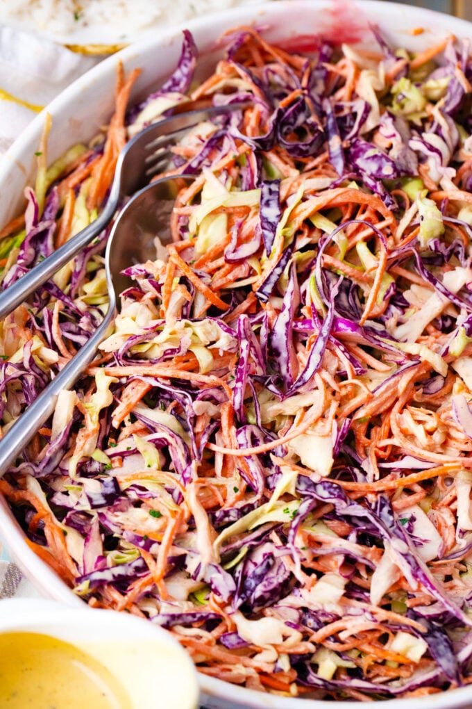 Overhead shot of coleslaw salad with green and purple cabbage.