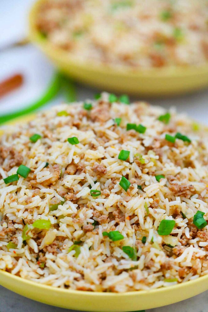 image of dirty rice in yellow bowls