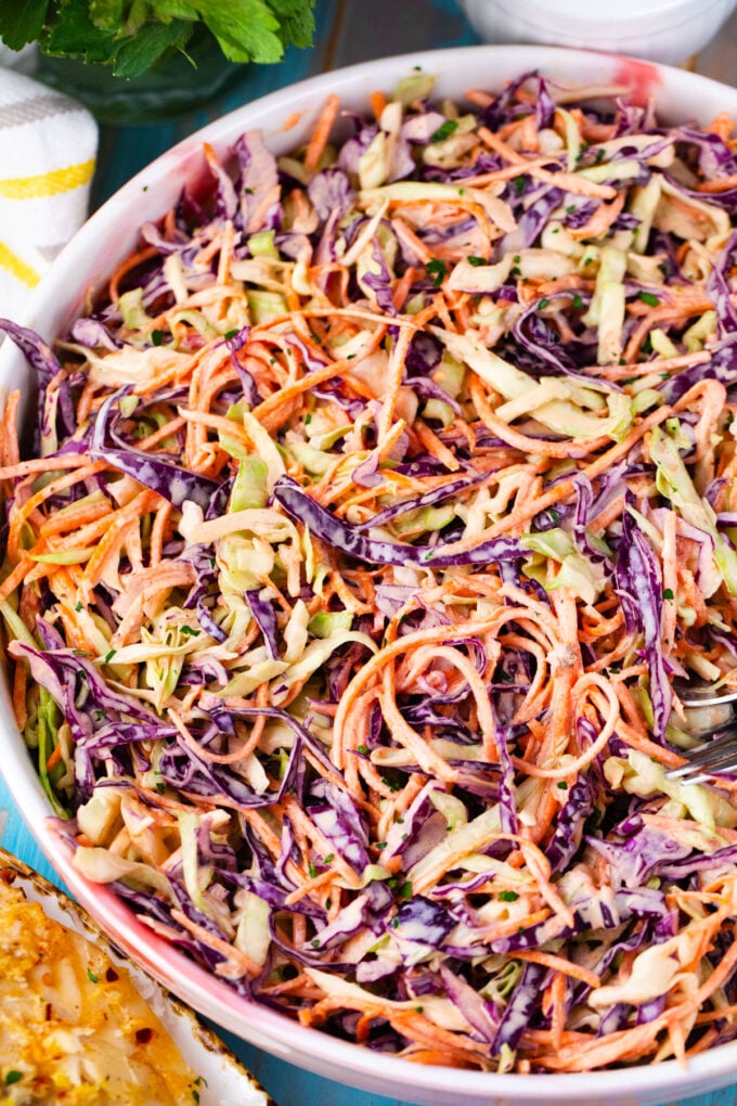 Green and purple cabbage homemade coleslaw with carrots.