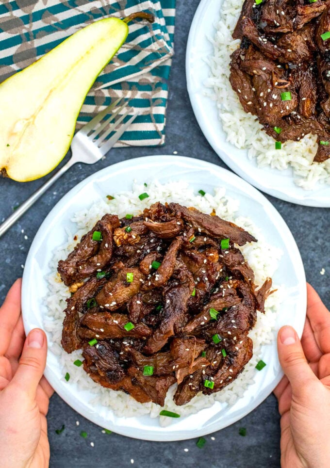 Beef Bulgogi topped with chopped green onion and sesame seeds over white rice.