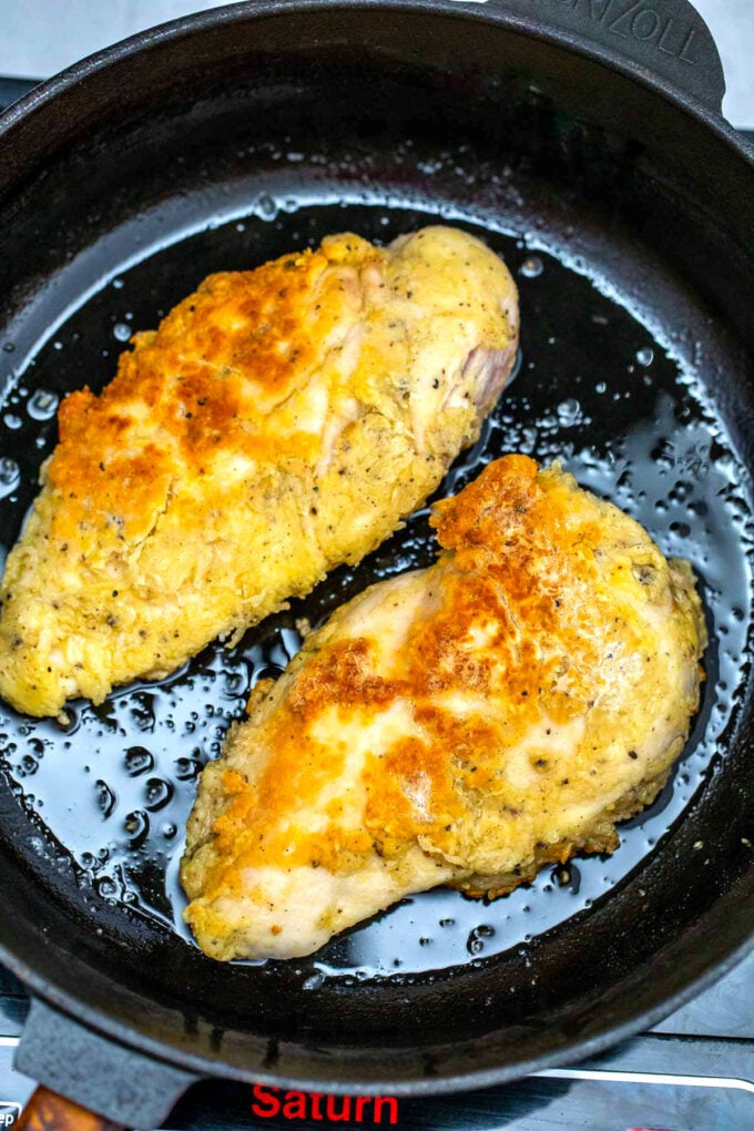 Photo of frying chicken breasts.