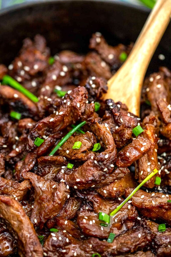 Korean BBQ Beef with green onions and sesame seeds in a skillet