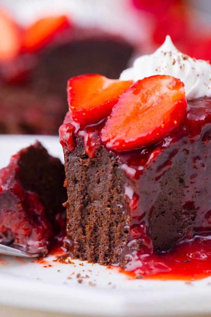 Fudgy low-carb chocolate flourless cake topped with strawberry sauce.