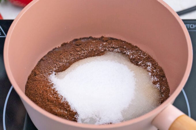 Sugar and cocoa powder in a saucepan.