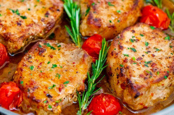 Homemade 30 minute skillet pork chops in maple syrup and apple cider vinegar sauce.