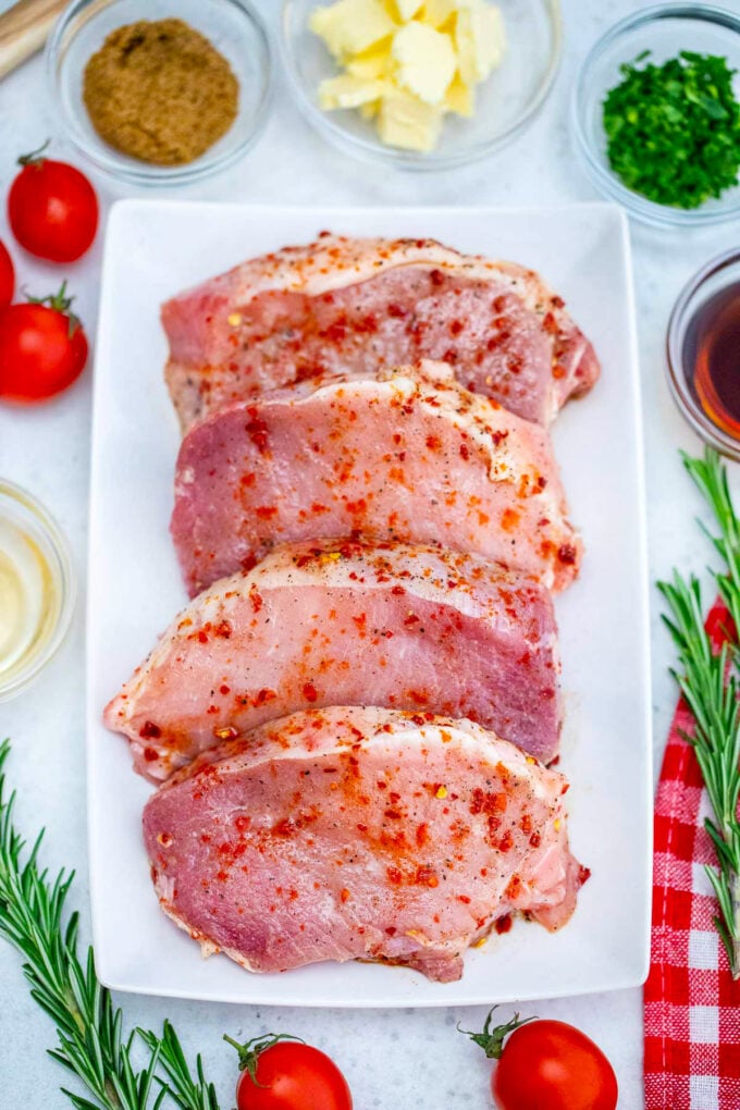 Overhead shot of 30 minute skillet pork chops ingredients arranged on a table.
