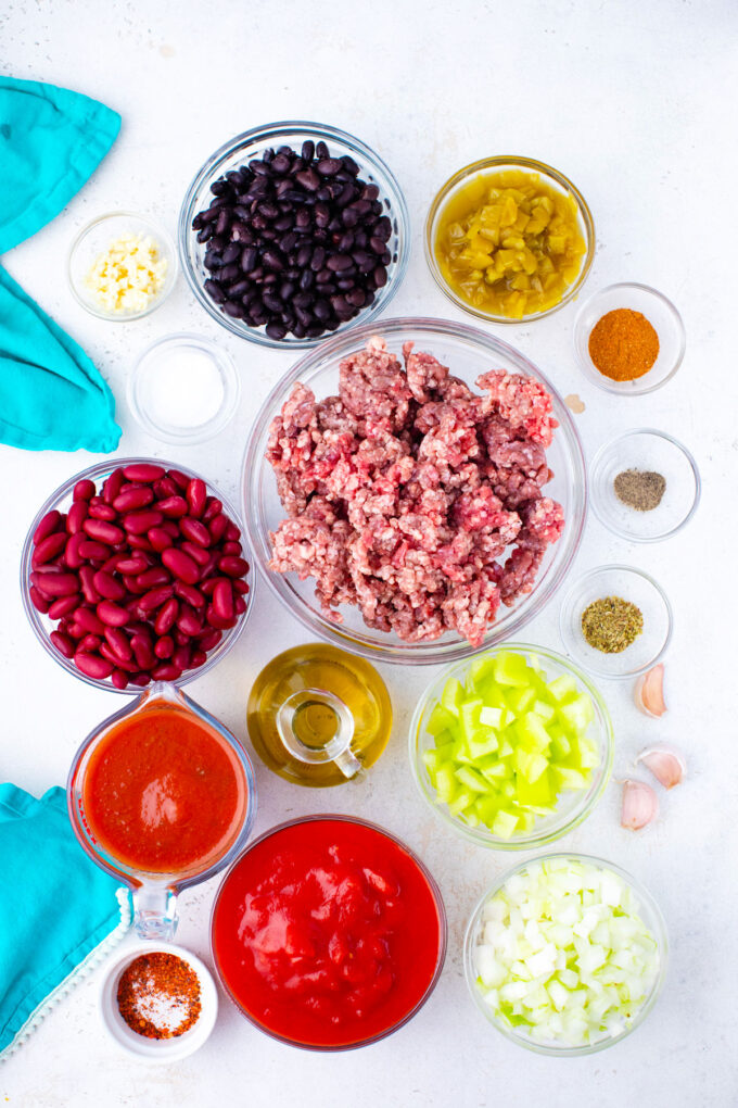 Overhead shot of Instant Pot taco soup in bowls on a white surface.