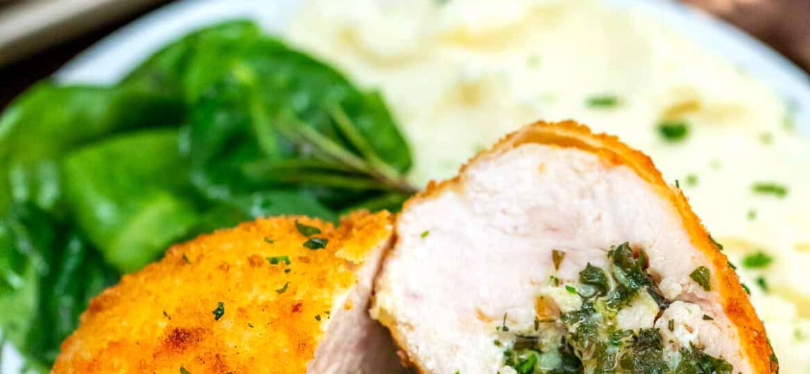 Picture of chicken Kiev sliced in half.