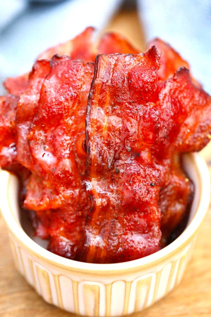 Image of homemade candied bacon in a white bowl.