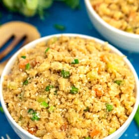 Image of cauliflower rice with peas and carrots.