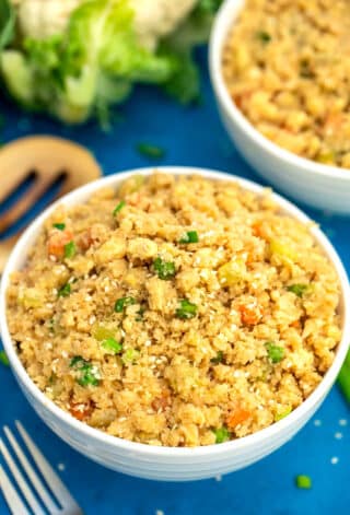 Image of cauliflower rice with peas and carrots.