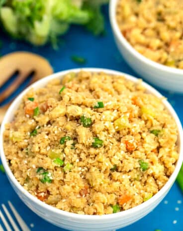 Image of cauliflower rice with peas and carrots.