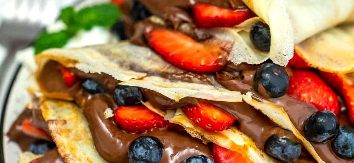 Photo of homemade crepes filled with Nutella.