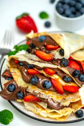 Photo of homemade crepes filled with Nutella.