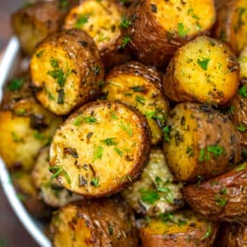 Picture of oven roasted baby red potatoes with fresh parsley.