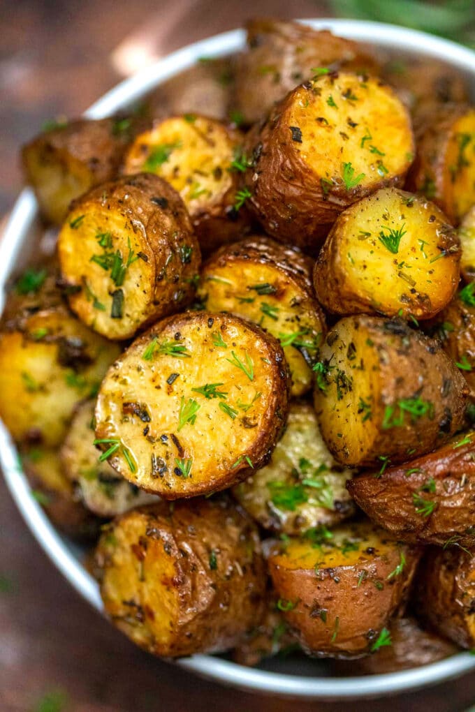 Picture of oven roasted baby red potatoes with fresh parsley.