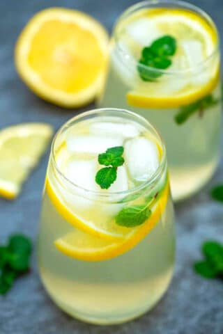 Photo of homemade lemonade with lemon slices and mint.