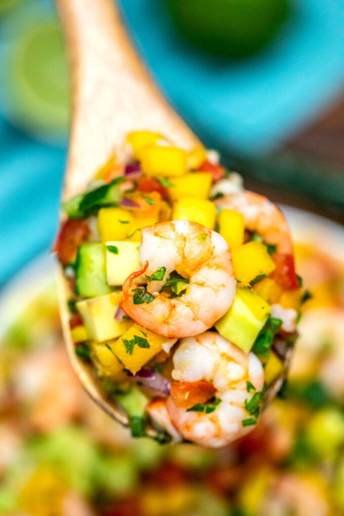 Picture of a spoon of shrimp ceviche.
