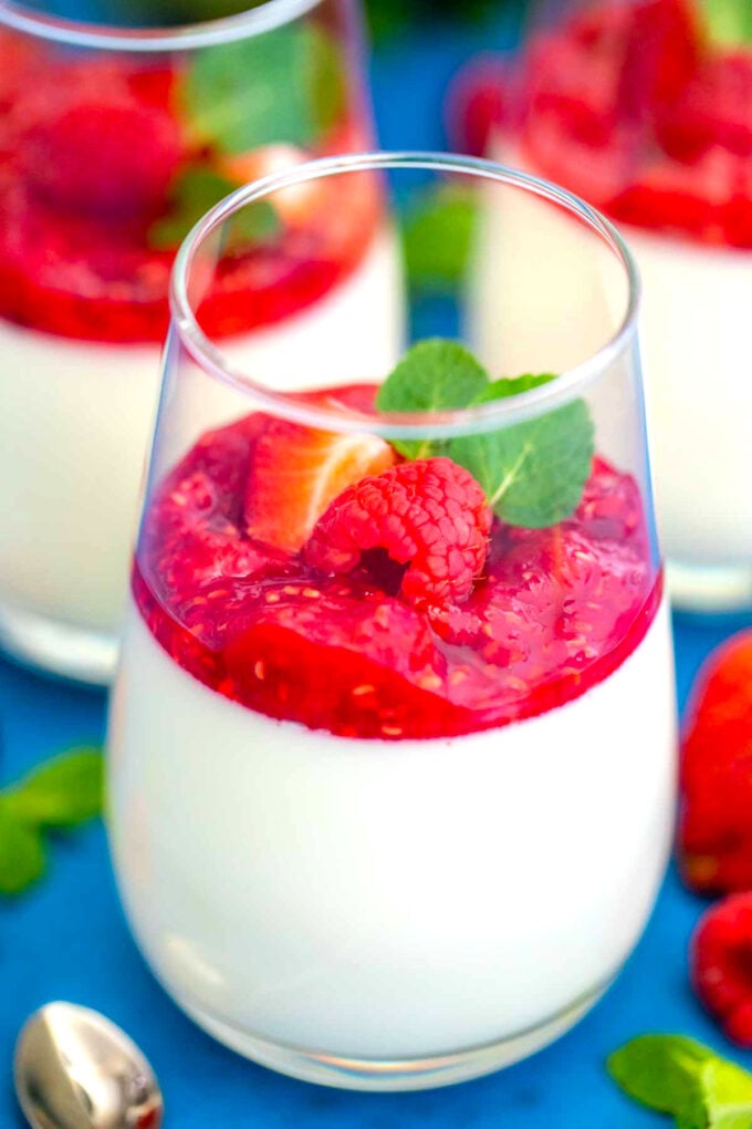 Photo of homemade Panna Cotta with raspberry and mint.