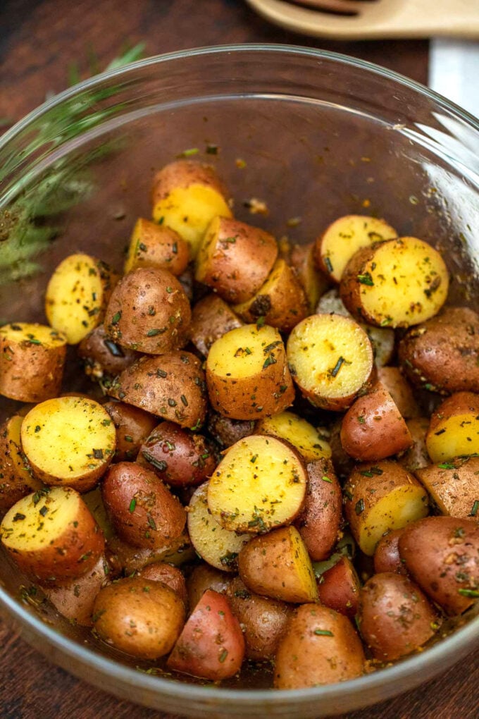 Picture of baby red potatoes in marinade.