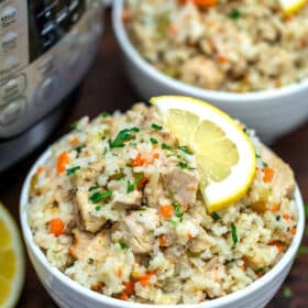 Image of lemon instant pot chicken and rice in a white bowl.