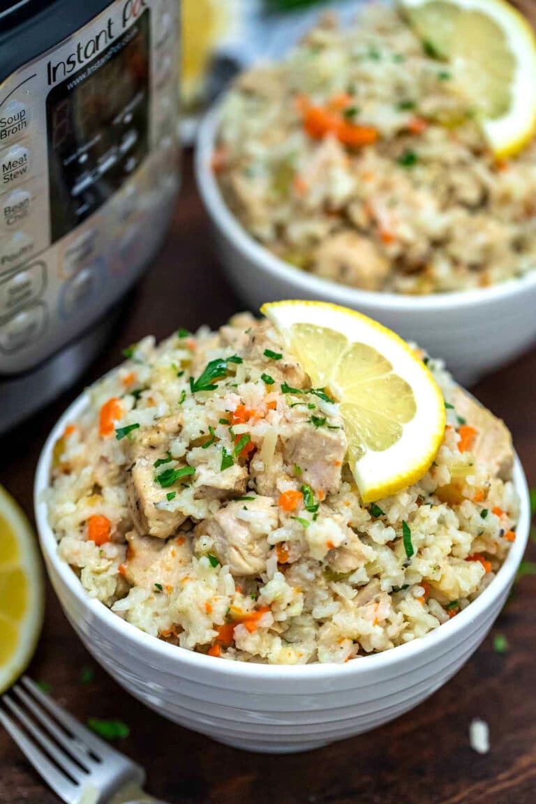 Image of lemon instant pot chicken and rice in a white bowl.