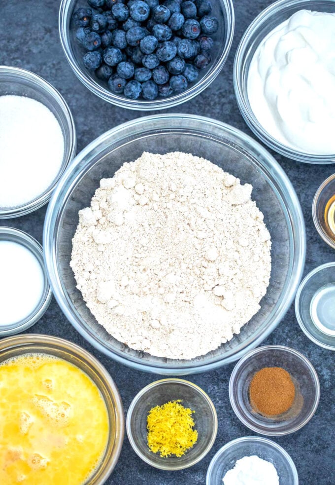 overhead shot of oatmeal pancakes ingredients in bowls on a table