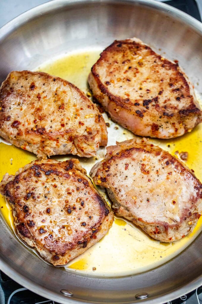 Searing boneless pork chops.