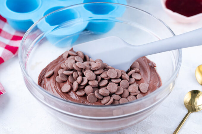 Stirring chocolate chips into instant pot chocolate muffins batter.
