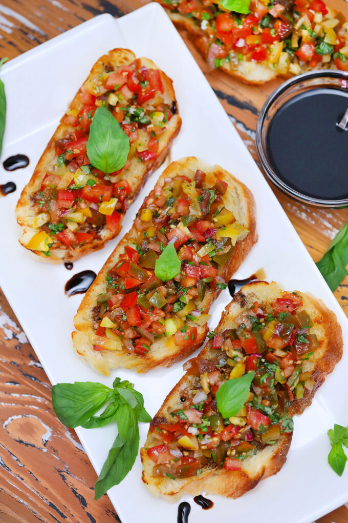 Photo of tomato bruschetta with basil.