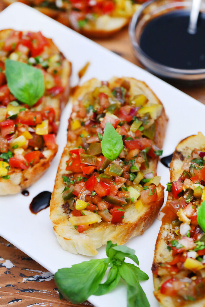 Image of tomato bruschetta with balsamic reduction.