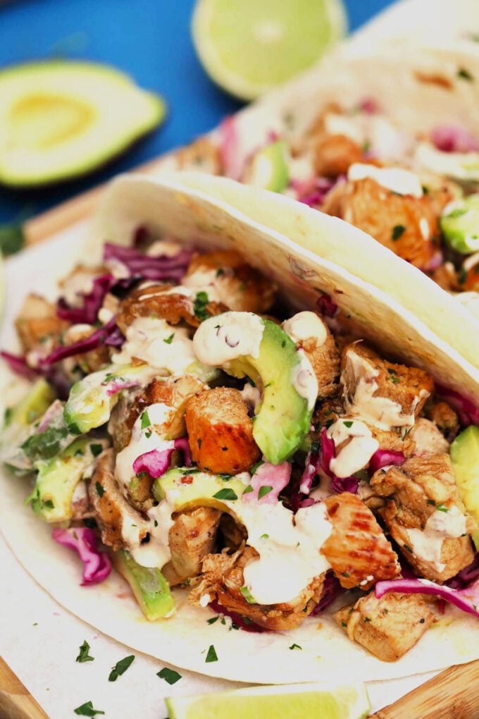 Photo of chipotle chicken tacos with avocado.