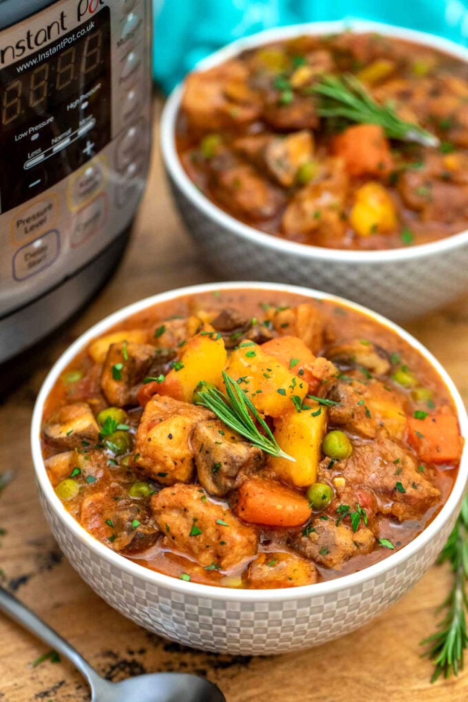 bowls pork stew next to the instant pot