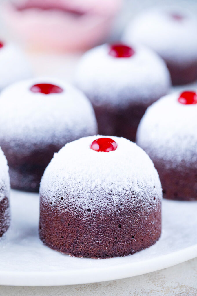 Homemade instant pot chocolate muffins topped with raspberry preserves.