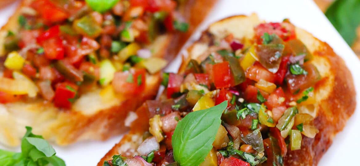 Photo of tri color tomato bruschetta.