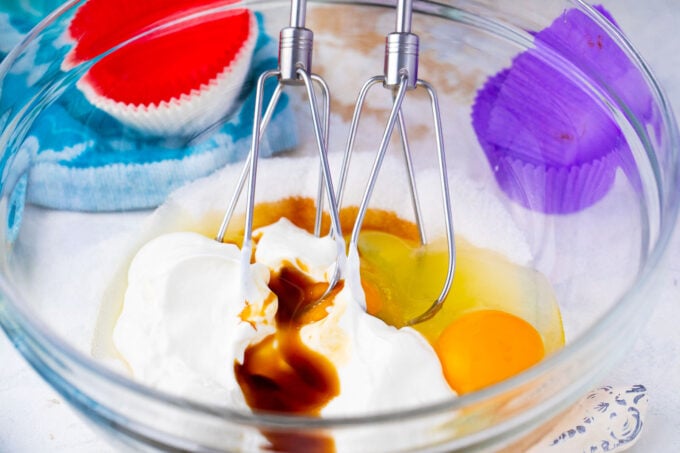 Mixing wet ingredients in a bowl.