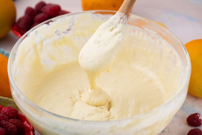 Pancake batter dripping of a spoon.
