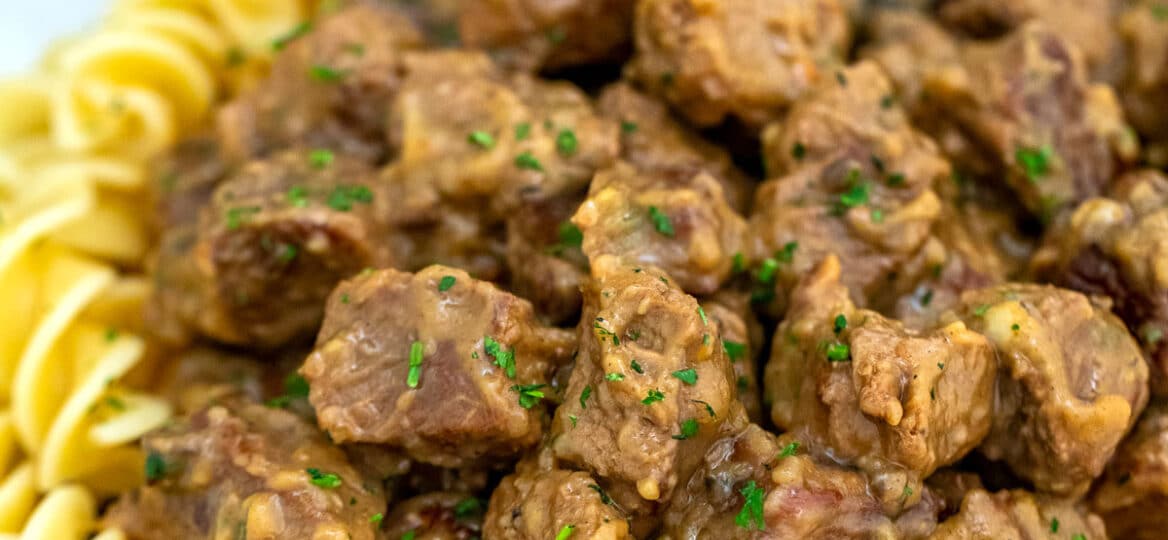 Picture of beef tips and gravy over noodles.