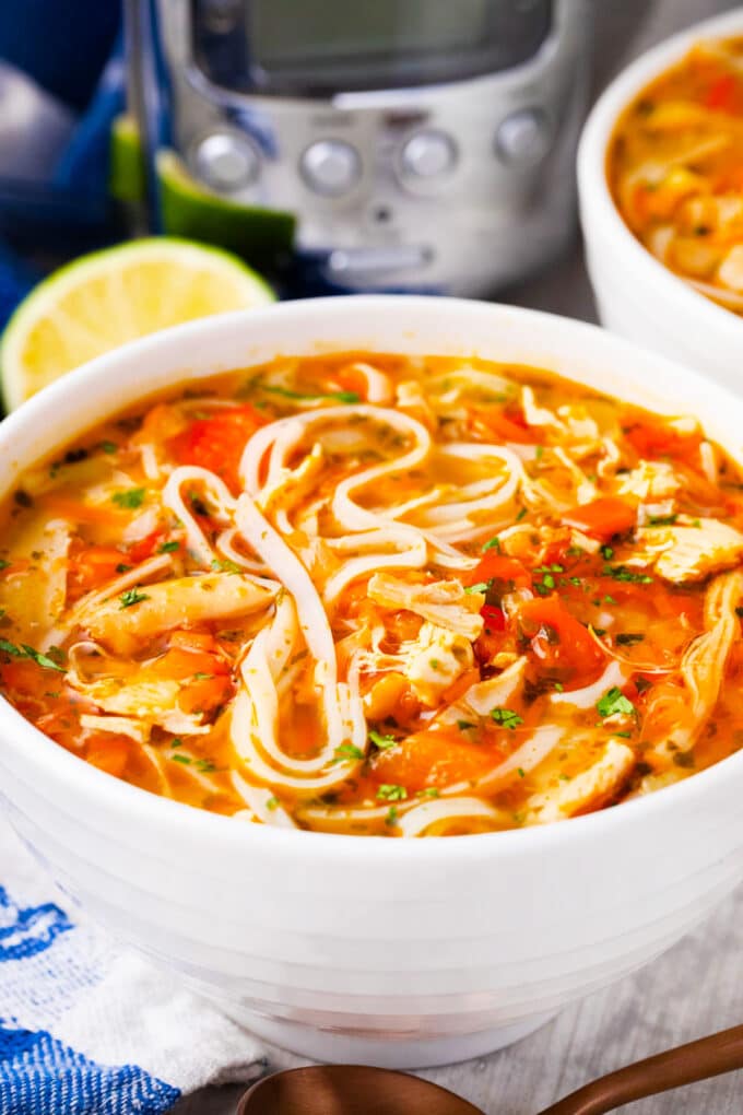A bowl of slow cooker Asian chicken noodle soup.
