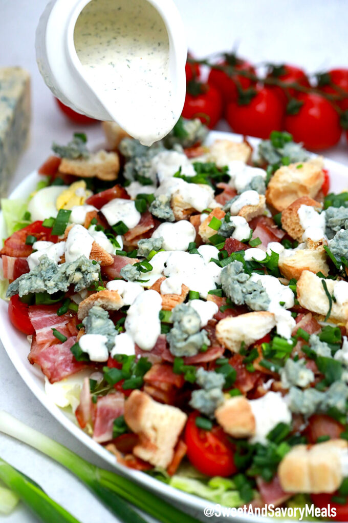 Picture of BLT salad with blue cheese dressing.