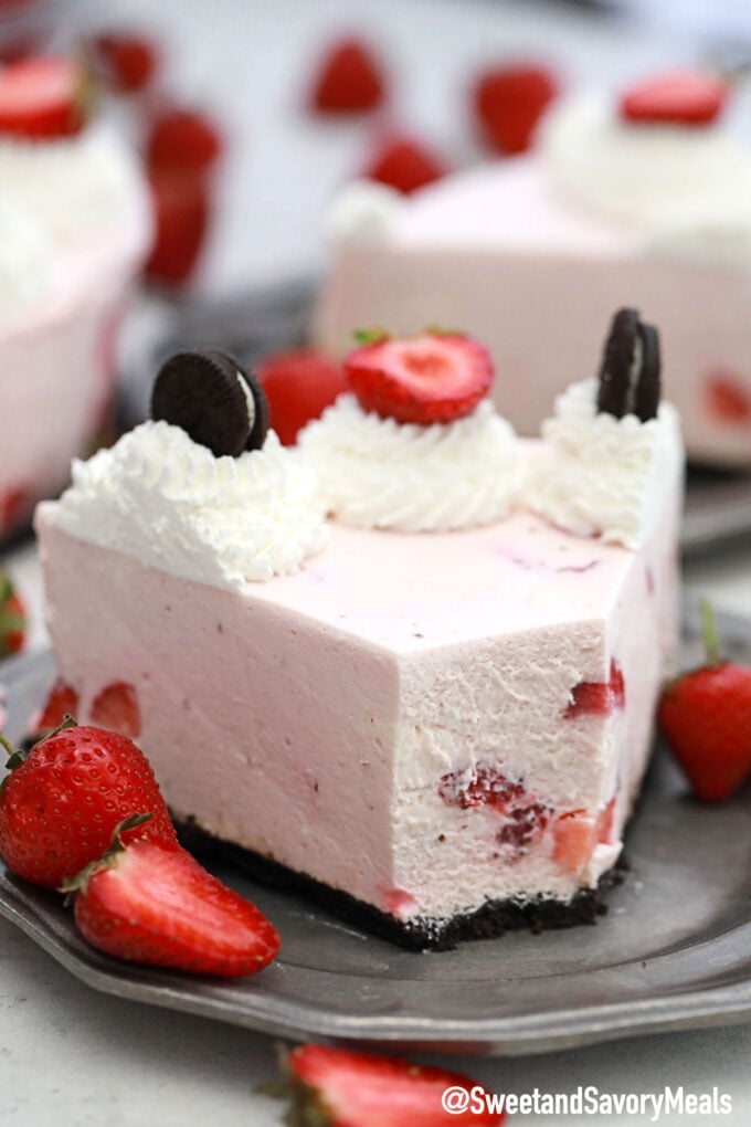 Photo of No Bake Strawberry Cheesecake slice with a bite.
