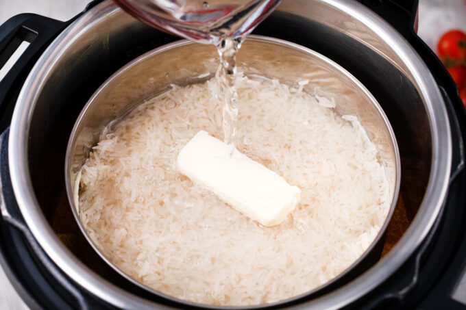 Adding a pot of rice to the instant pot.