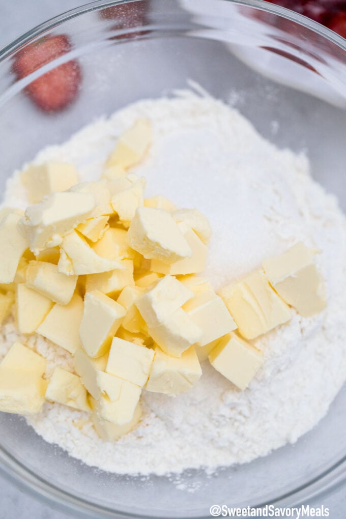 strawberry cobbler topping ingredients made of flour and butter in a bowl